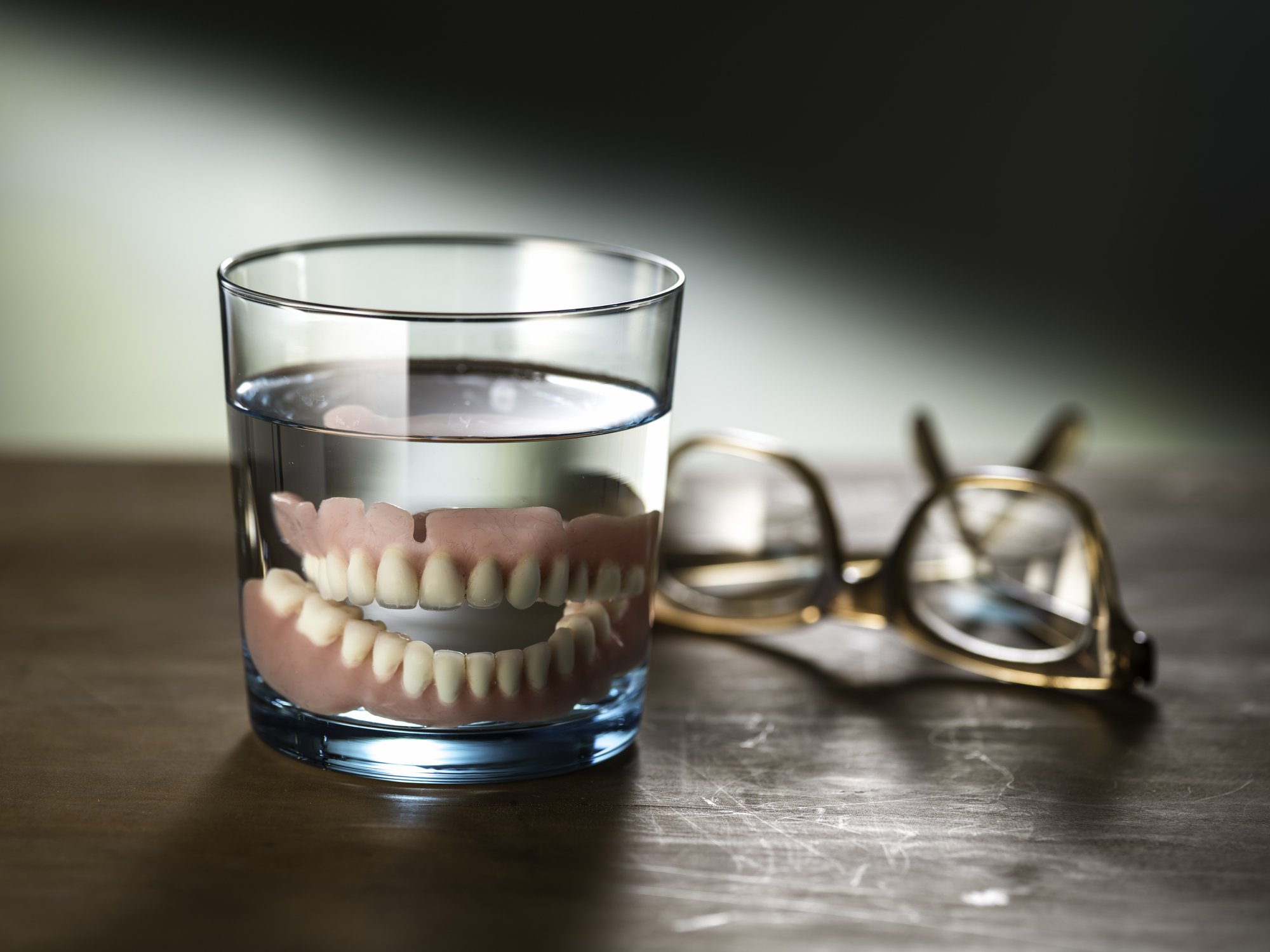 dentures in glass of water