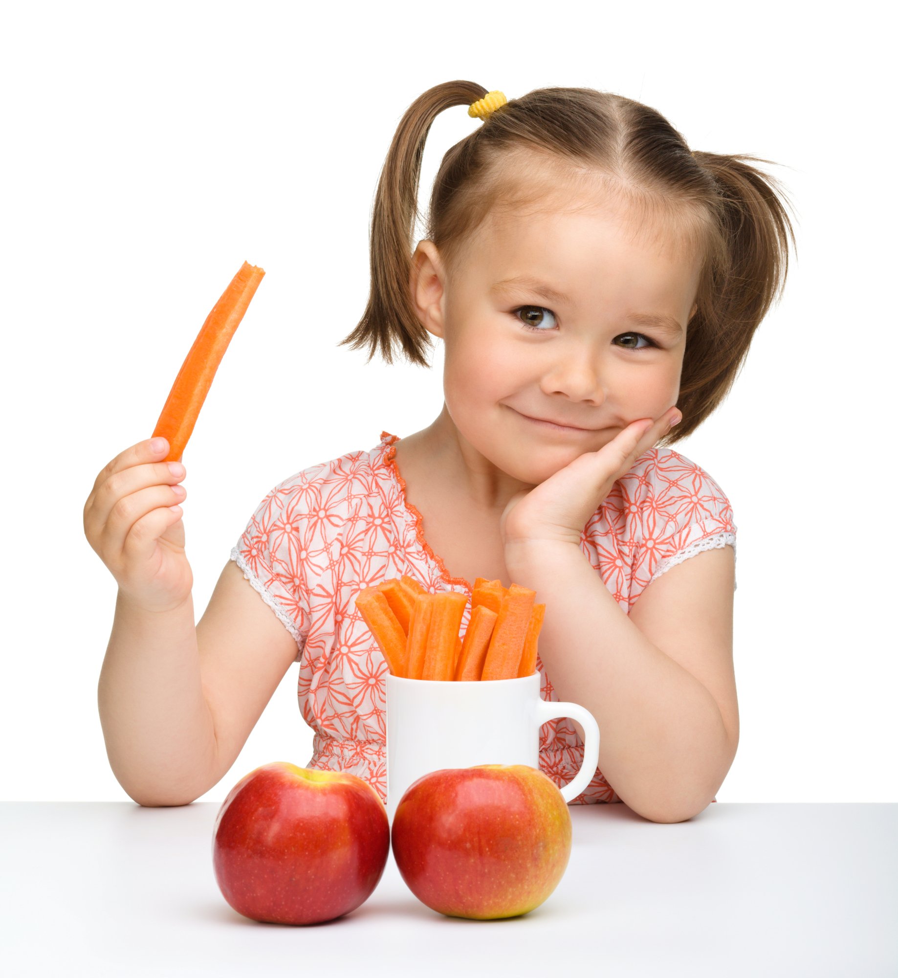 little girl holding carrot