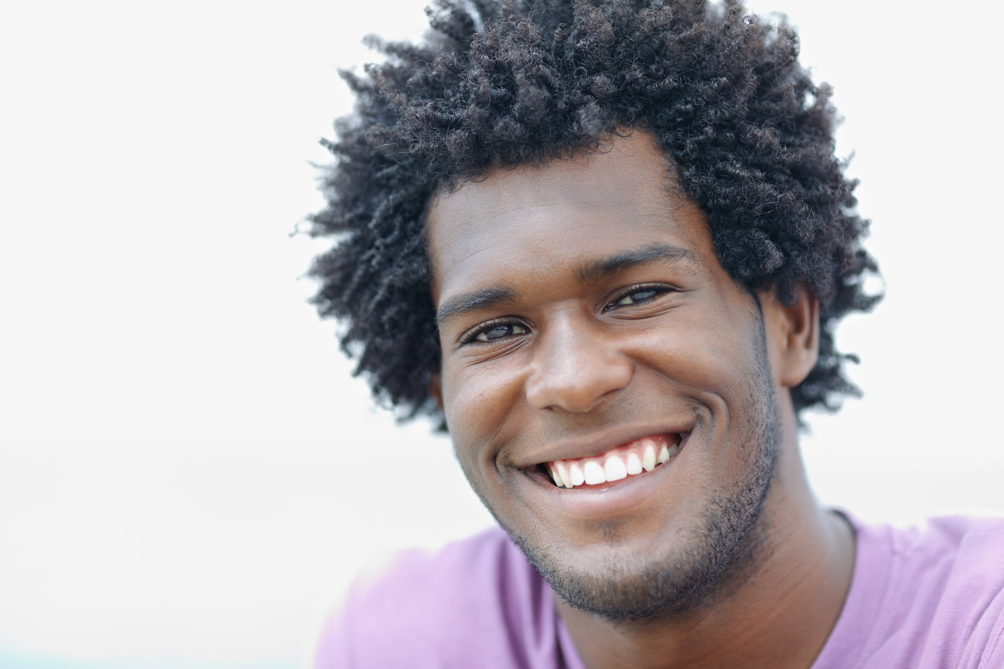 portrait of man smiling at the camera