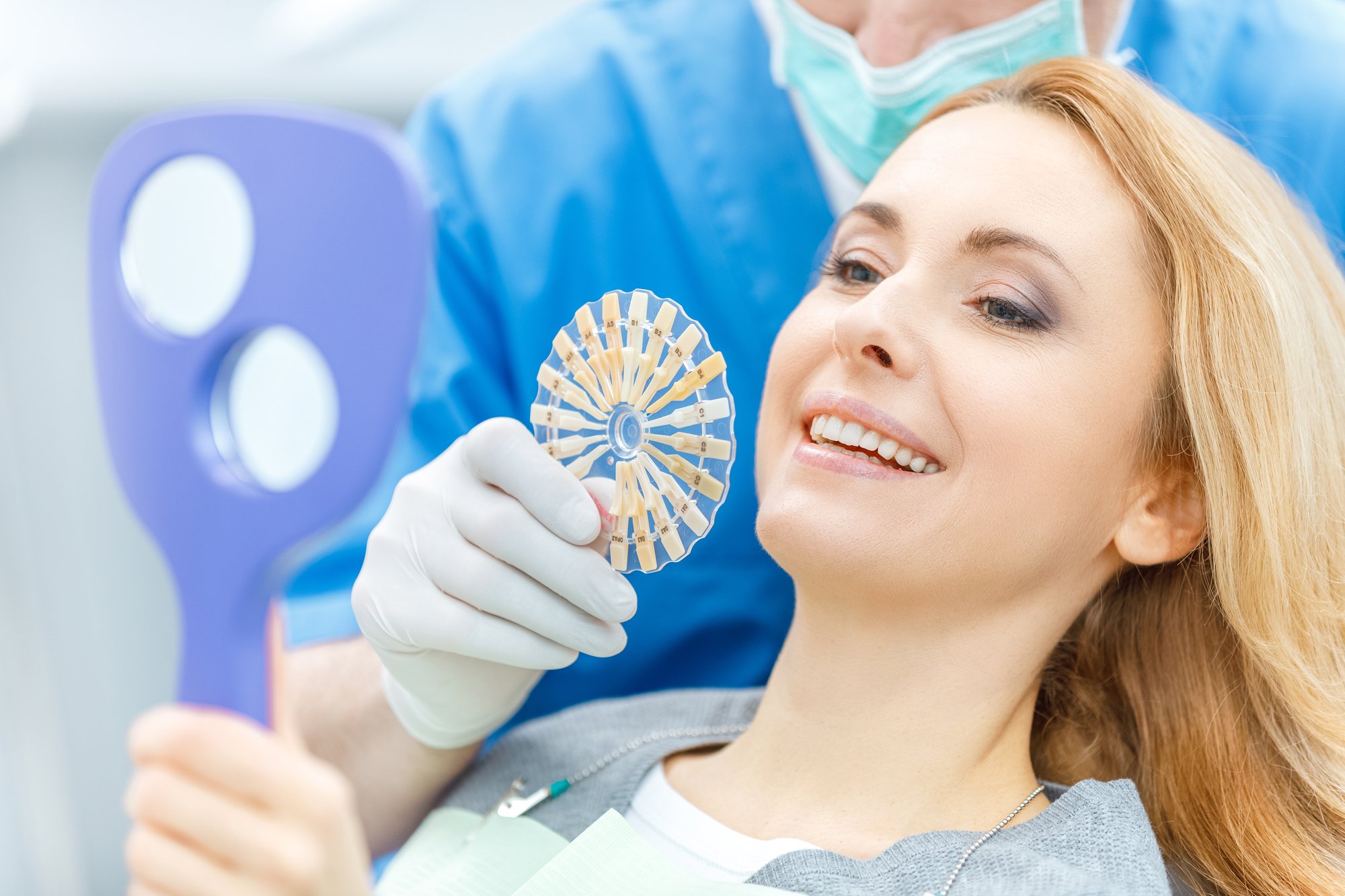 female patient receiving tooth crown