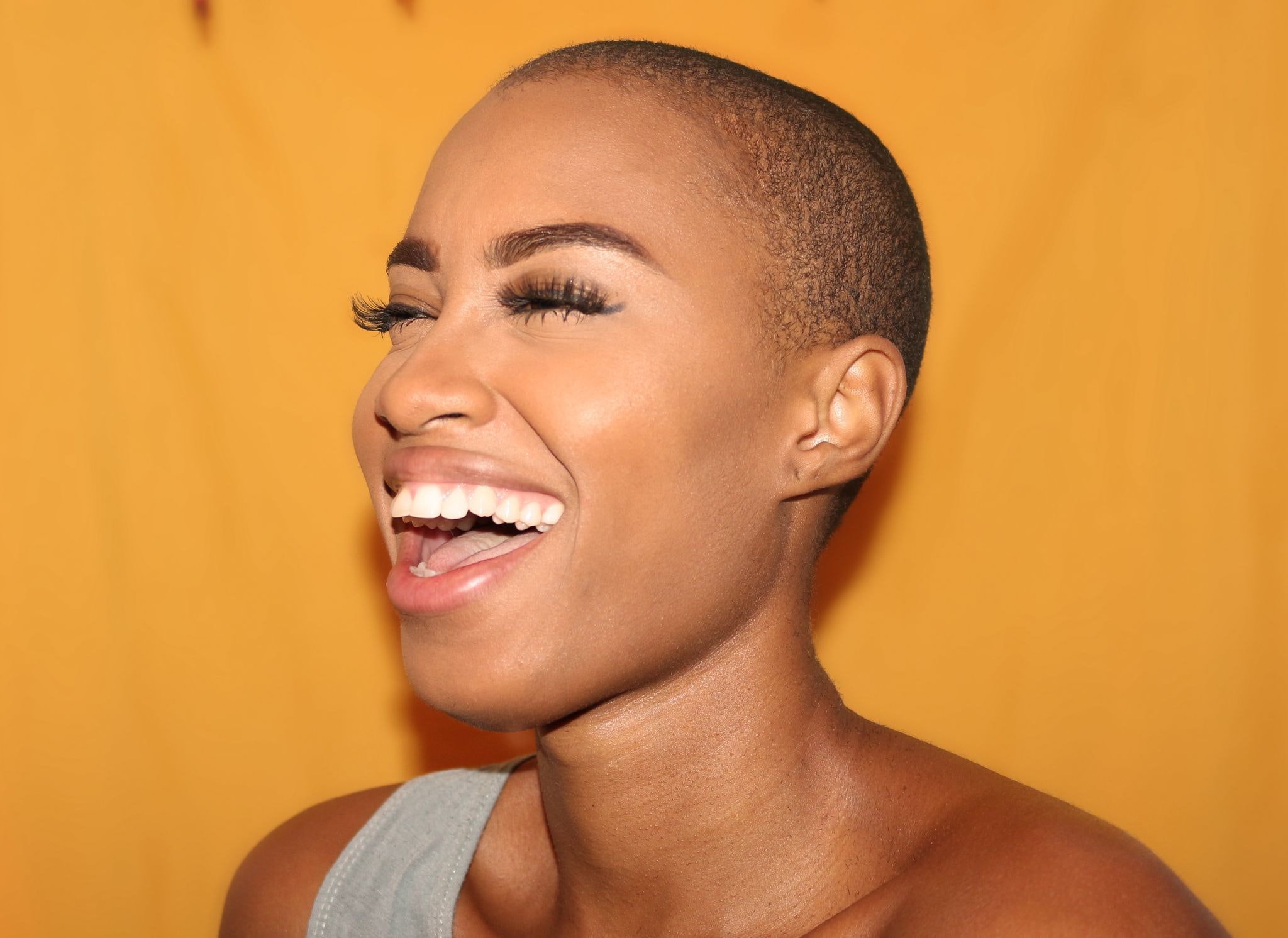 woman smiling before Invisalign treatment