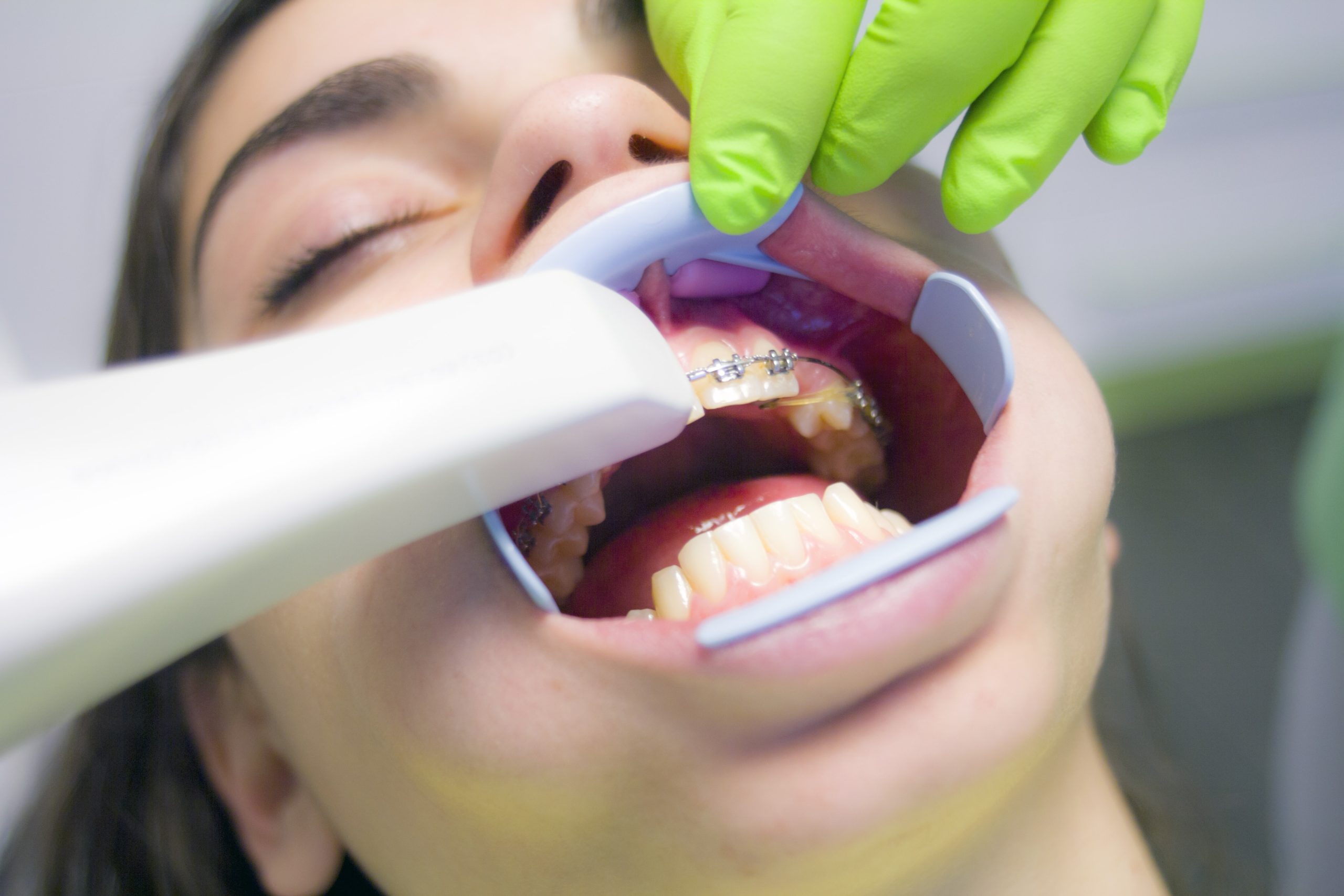 A Woolgoolga dentist works on a patient's mouth