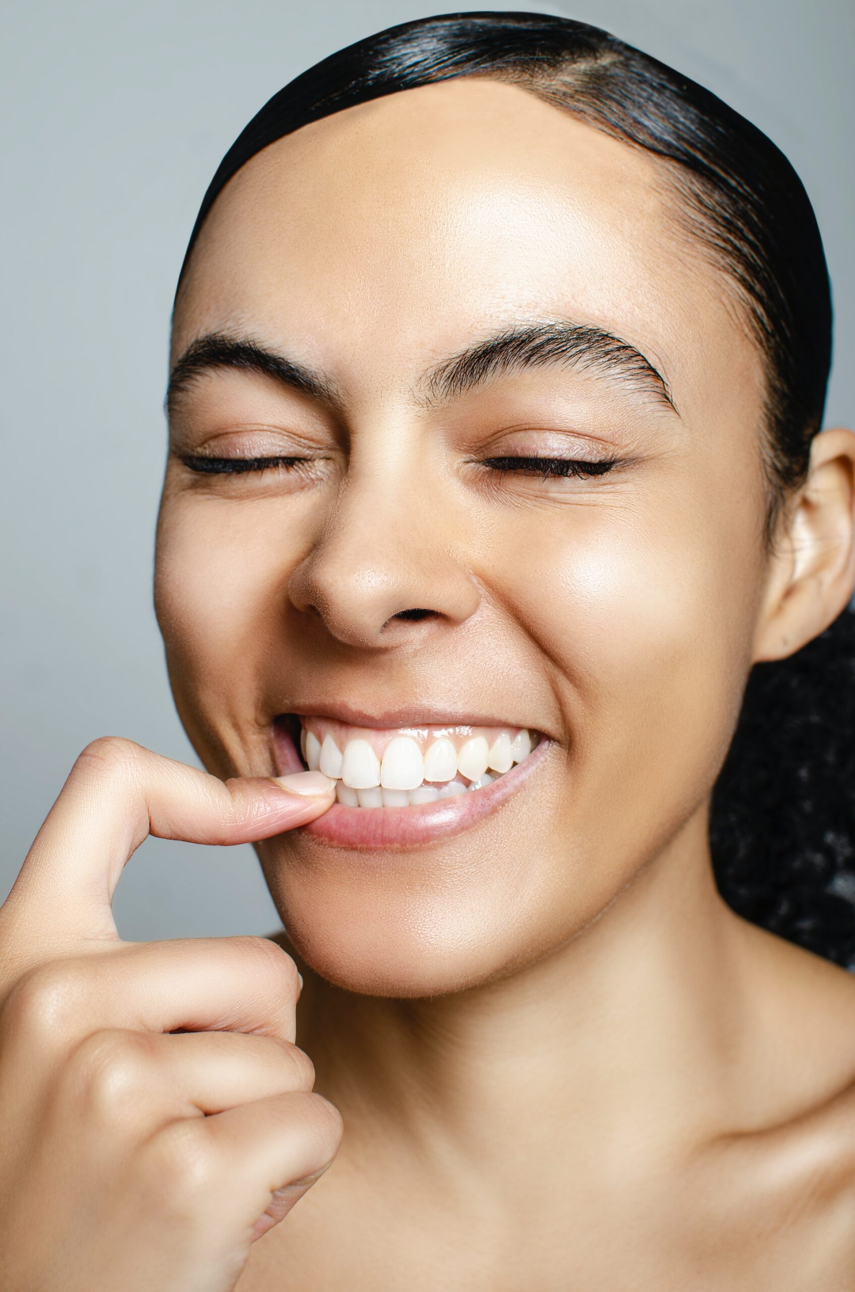 Woman smiles before a visit with her Woolgoolga dentist.