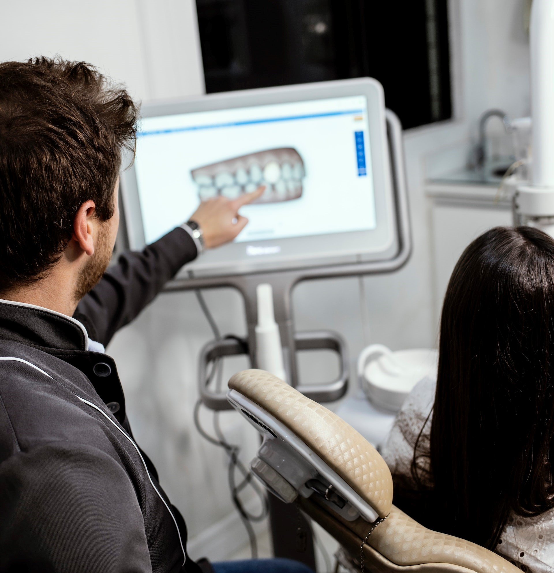 Gentle dentist explains x-ray with new technology.