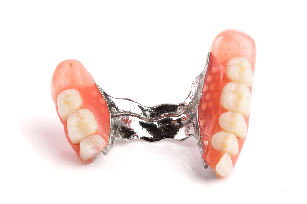 partial denture on white background